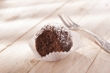 sweet and delicious chocolate balls with coconut flakes 