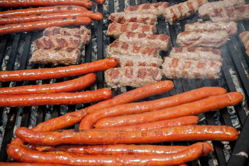 Assorted delicious grilled meat  over the coals on a barbecue