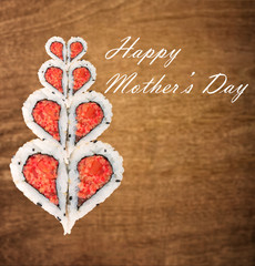 Fototapeta na wymiar Happy Mother's day concept with sushi forming heart shapes again