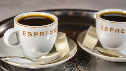 Closeup of two small cups with espresso