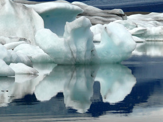Iceberg mirroring in the glacial lagoon Jökulsárlón, Iceland