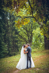 Wedding shot of bride and groom in park