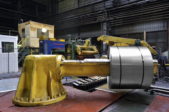 Cold rolled steel coil on decoiler of machine in metalwork