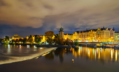 National theater and Mánes house reflection during rainy night, Prague, Czech republic