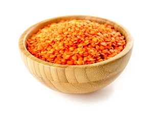 Bowl of nutritious red lentils studio isolated