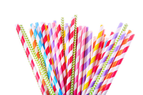 Colorful drinking striped straw on white background