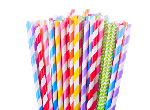 Colorful drinking striped straw on white background