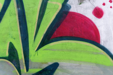 Detail of a graffiti art on a wall. Wall painted in green and re © msnobody