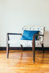 Empty wooden chair with pillow