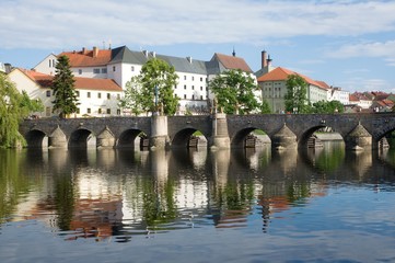 Fototapeta na wymiar Medieval Town Pisek and historic stone bridge over river Otava in the Southern Bohemia, Czech Republic