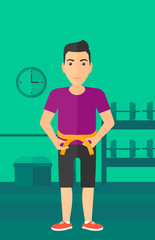 Man measuring waist.