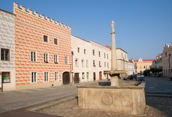 Fototapeta premium Historic buildings with sgraffito and fountain in town Slavonice, southern Bohemia, Czech republic