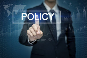 Businessman hand touching POLICY button on virtual screen