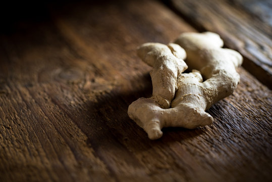 Ginger root on dark wooden background