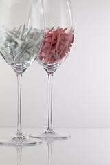 Two glasses of wine and golf equipments