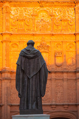 Naklejka premium The priest statue in front of the New Cathedral of Salamanca