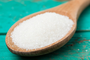 spoon and sugar and  on wood table
