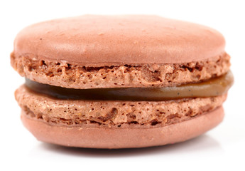 Brown macaron isolated on white