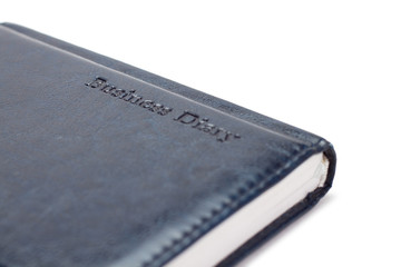business diary over white background
