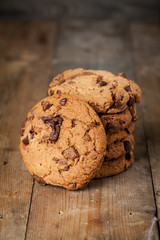 Fresh homemade cookies on rustic wooden table.