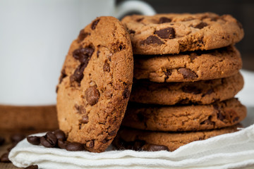 freshly baked chocolate chip cookies on rustic wooden table