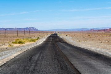 grey tared road in namibia, africa