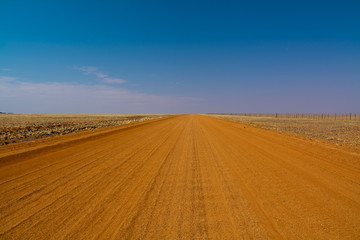 Fototapeta na wymiar red sand gravel road