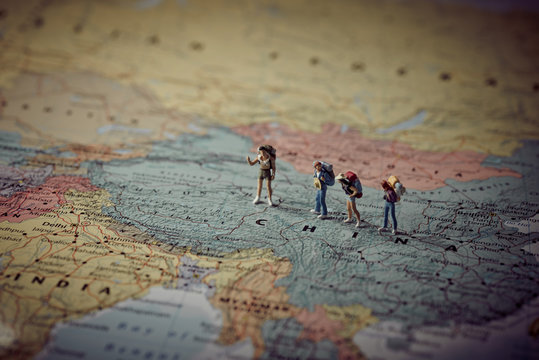 Miniature tourists in China. Color tone tuned.