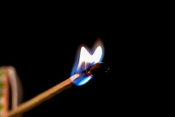 Lighting a match with flames and smoke