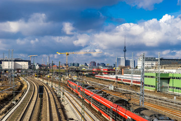 Fototapeta na wymiar Railway tracks going through the city center of Berlin, with cityscape in the background