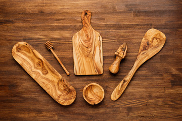 kitchen utensils on wooden background. spoon, mortar, 