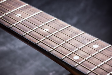 Grunge guitar fret board background.