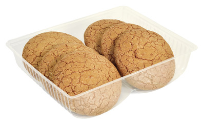 round cookies with almonds in a plastic form