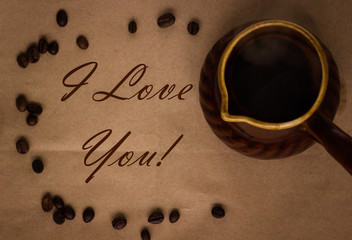 cofee beans seeds on brown paper background and clay pot, i love