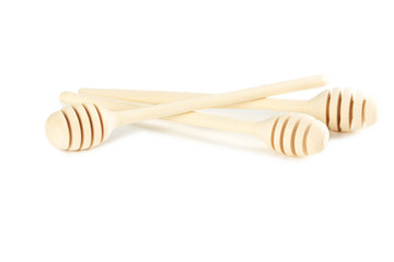 Wooden honey dipper isolated on a white