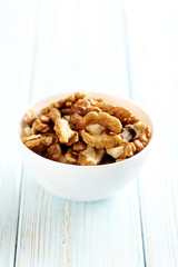 Walnut on a blue wooden table