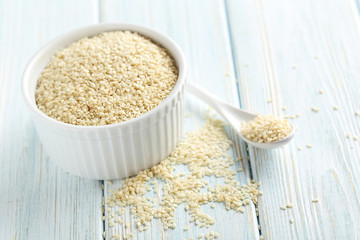 Sesame seeds on a blue wooden table