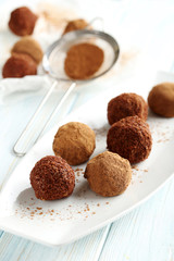 Sweet chocolate truffle on a blue wooden table