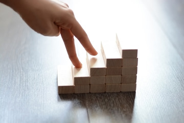Careers level concept with wooden blocks made by stairs in the white isolated background
