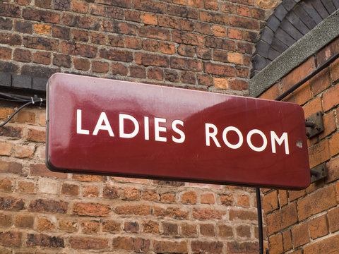 British Railways era (mid 20th century) railway station ladies room sign, maroon colour as typically seen in the London Midland region of the nationalised railway.