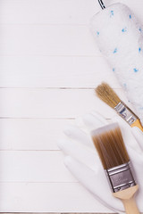 Tools for working with paint on wooden table and additional space for text