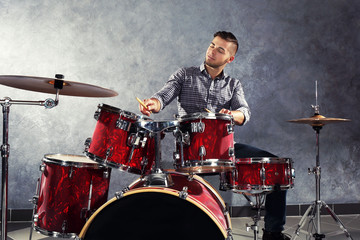 Fototapeta premium Musician playing the drums in a studio