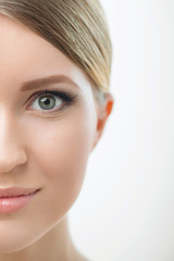 Obraz premium Attractive woman looking at you on white background 