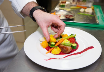 Chef is decorating appetizer
