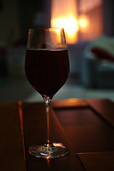 Glass of red wine on blurred background