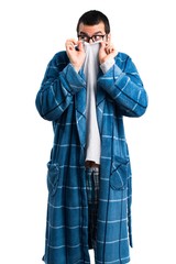 Man in dressing gown hiding behind his shirt