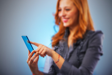Businesswoman pressing touch screen interface.