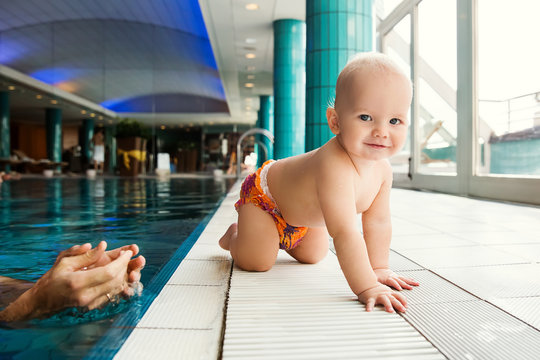 Smiling Charming Baby In Swimming Pool