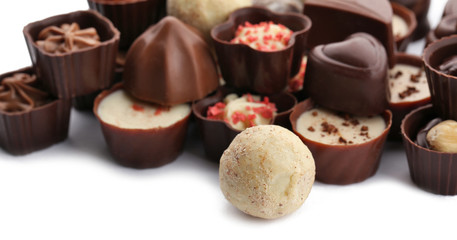 Assorted collection of chocolate candies and sweets, isolated on white