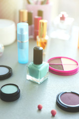 Nail polish with makeup cosmetics on a table